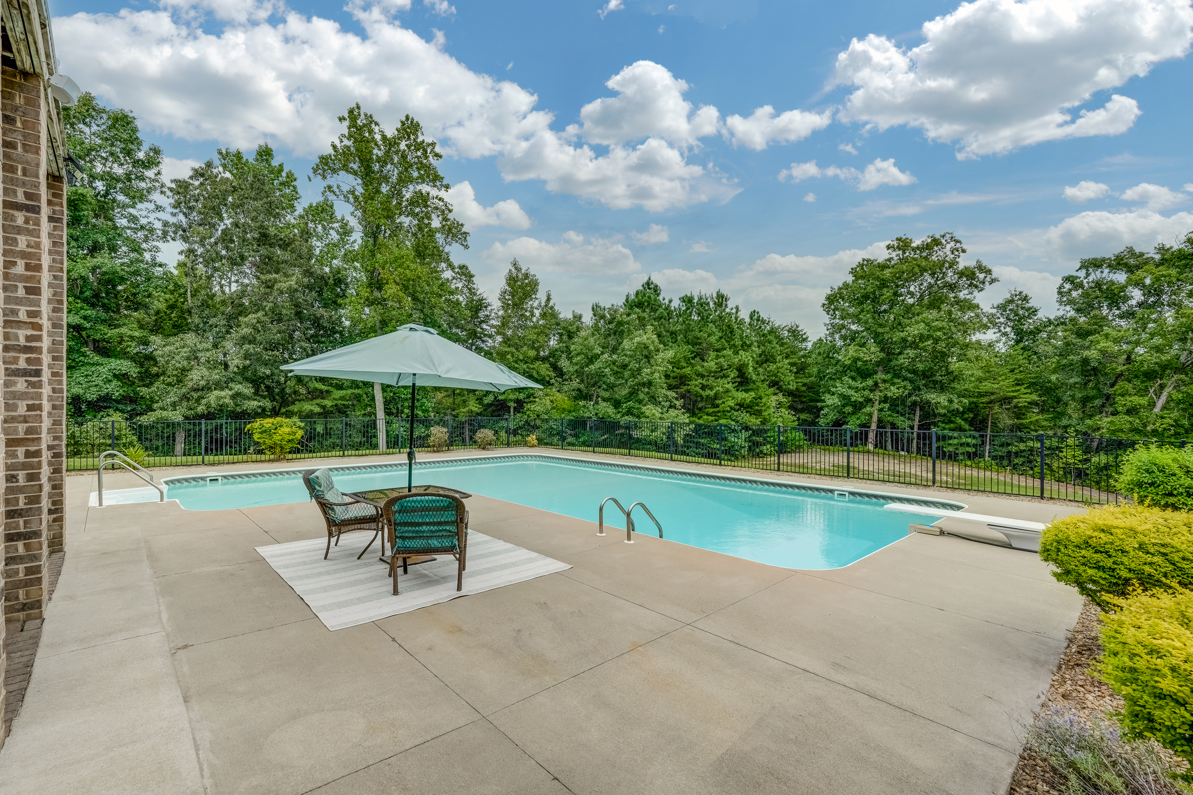Enjoy your own private oasis with this lovely heated, saltwater pool overlooking the expansive backyard
